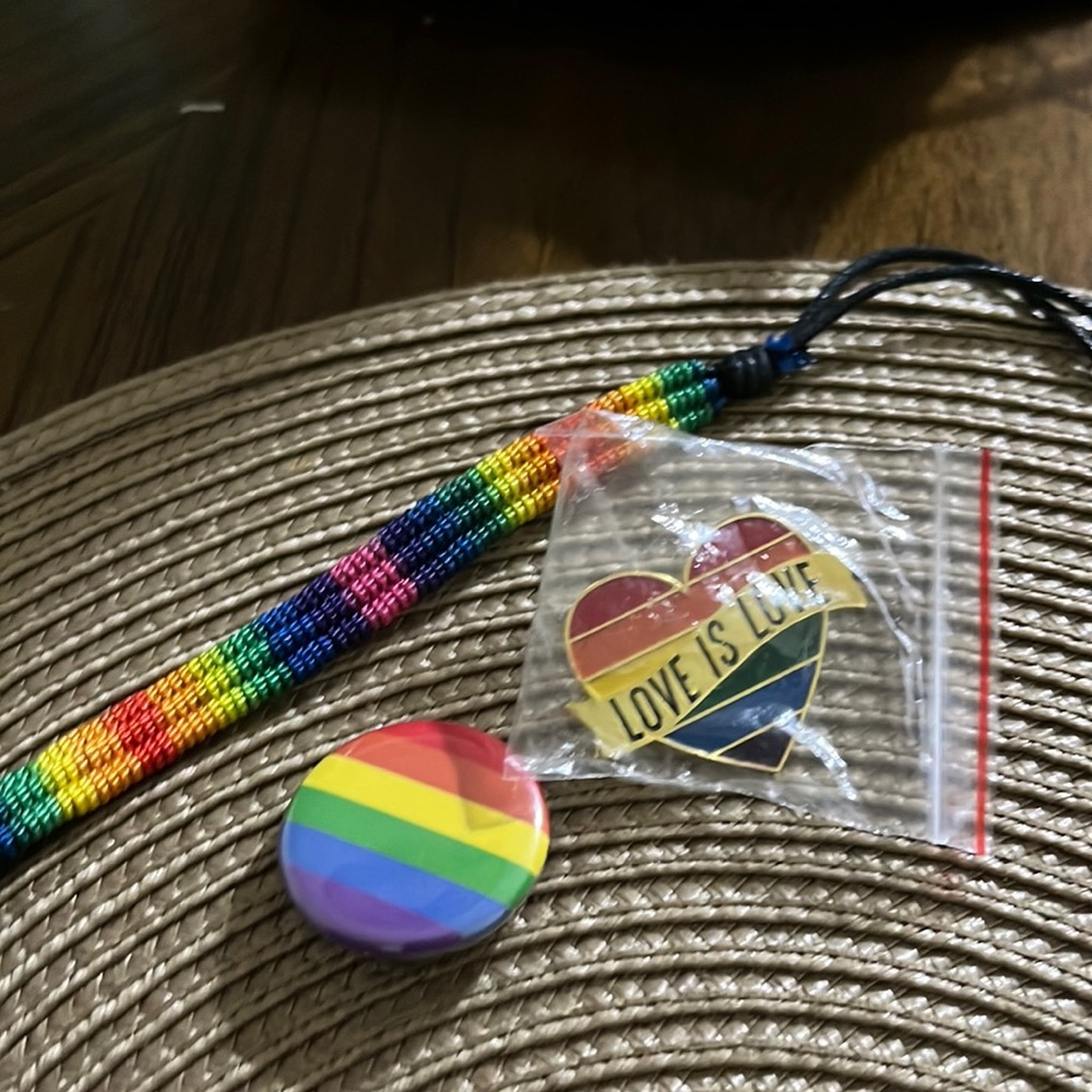 LGBTQ+ pride bracelets and pins
